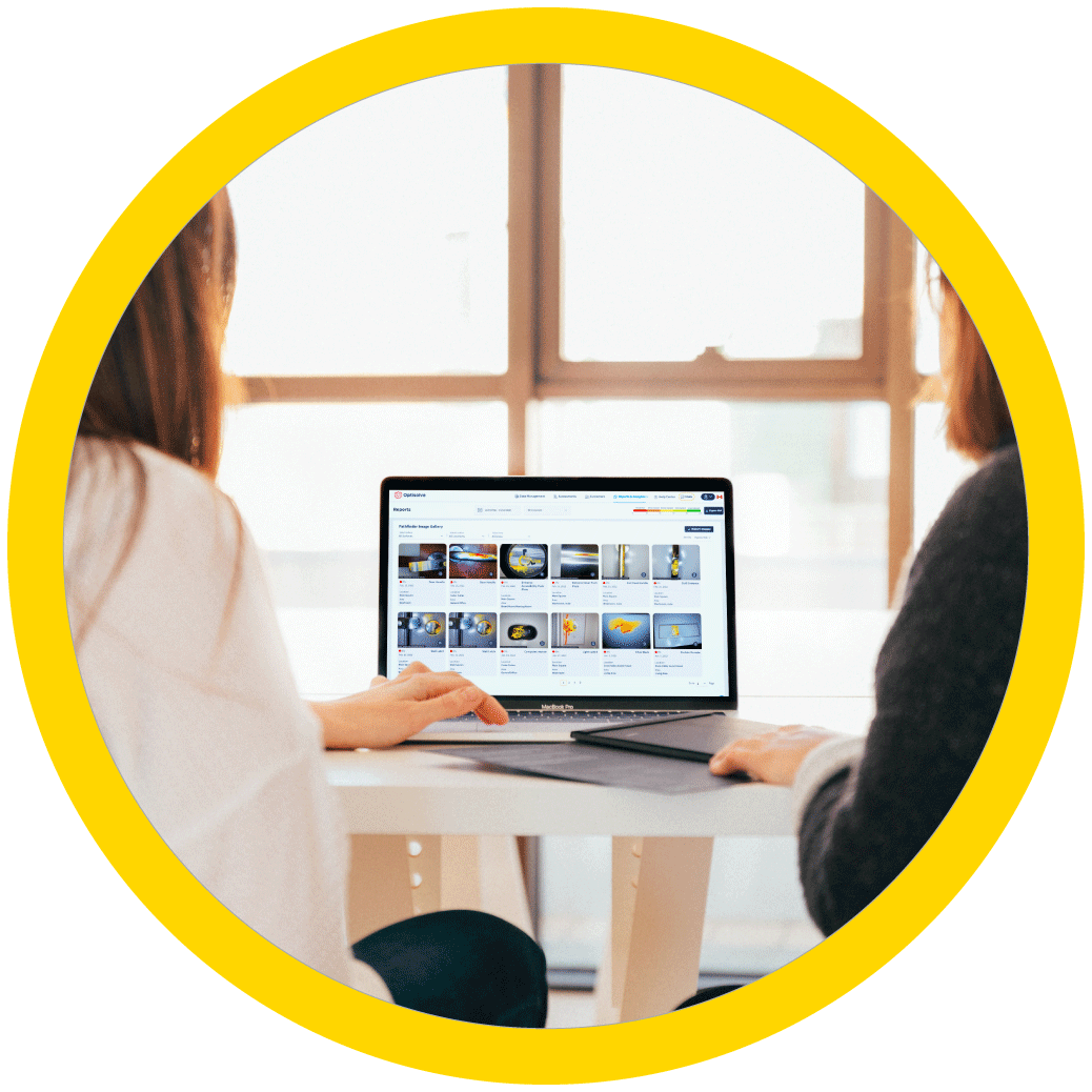two women reviewing optisolve pathfinder results