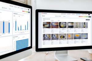 optisolve SAVI quality management system digital reports on two desktop screens 